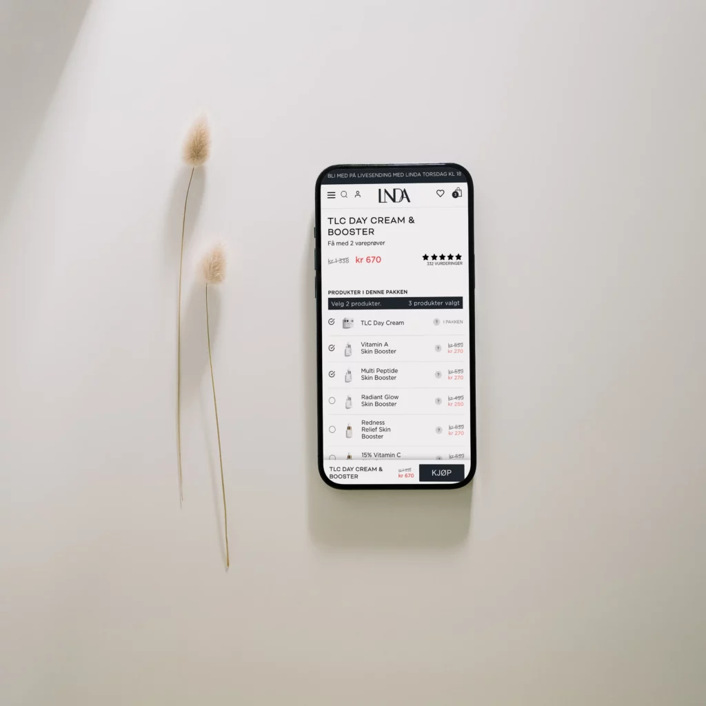 bilde av mobil som viser produkt i nettbutikken lindajohansen.no